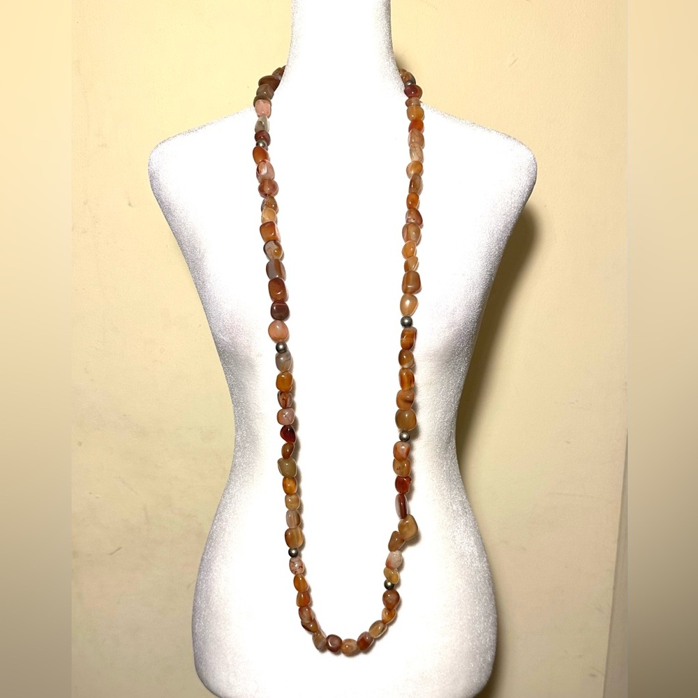 Amber-colored stone necklace, approximately 49” long